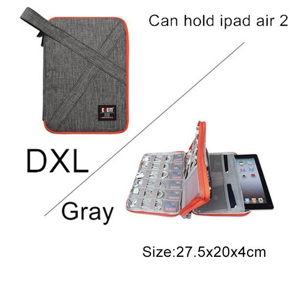 DXL grey Cable Organiser bag for travel. it is rectangular with a grey zipper. it has multiple bands for cables on 2 sides and there is an extra pouch with pockets that fits phones or tablet.