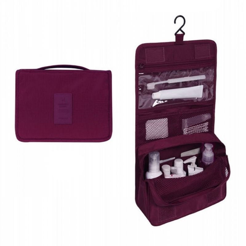 Solid Burgundy Coloured hanging toiletry bag. the pattern is diamond shapes. Great for travel with a large pouch with zipper, a net mesh with zipper and a clear transparent pouch with zipper, with a hook above it tp all folds into a compact bag with carry handle. hang on doors or shelving. All folds up into a neat bag with carry handle.