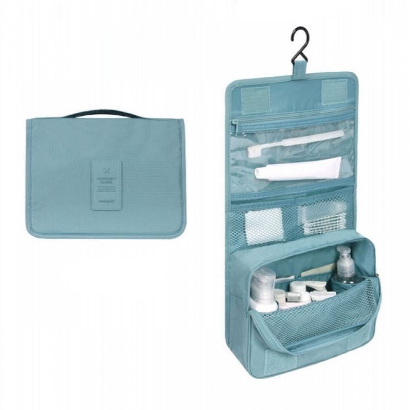 Solid Light Blue Coloured hanging toiletry bag. Great for travel with a large pouch with zipper, a net mesh with zipper and a clear transparent pouch with zipper, with a hook above it tp all folds into a compact bag with carry handle. hang on doors or shelving. All folds up into a neat bag with carry handle.