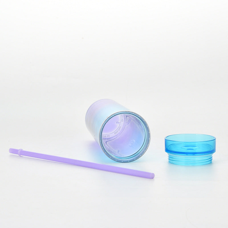 this image shows the blue cup on its side and you can see the inside of the cup, the lids unscrewed and the straw is next to the cup. All made with BPA free plastics