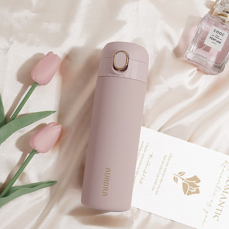 This is the light su Pink Aurora Bottle with gold edged flip button and gold Aurora Lettering