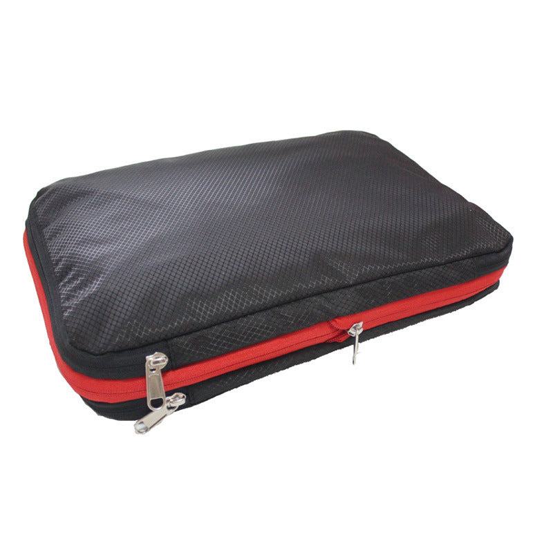 A single Compression Packing Cube it is black with red zipper, and is rectangular shaped