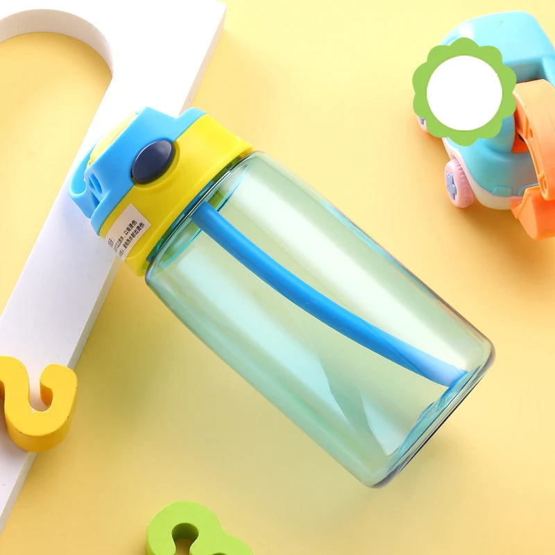 this is the blue kids water bottle with straw the lid has a yellow band at the bottom, the handle is blue matching the cup. the straw enclosure is yellow and the flip button is navy.