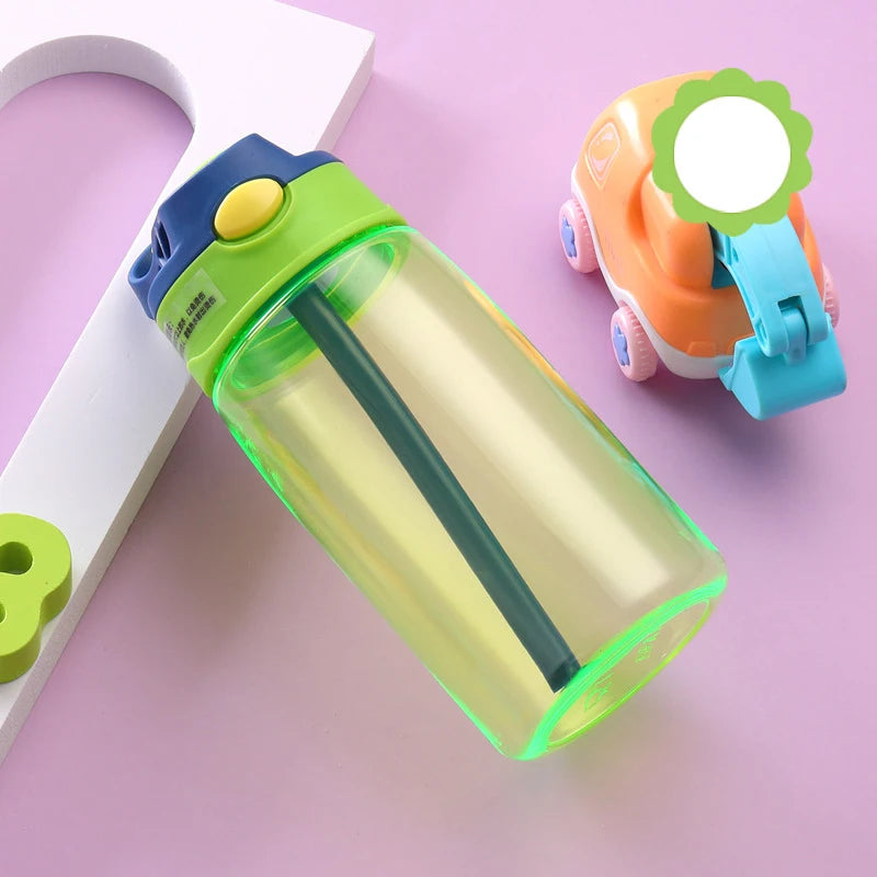 this is the green kids water bottle with straw the lid has a green band at the bottom, the handle is blue matching the straw. the straw enclosure is green and the flip button is yellow.