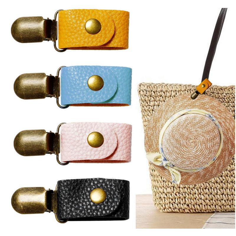 the photo has four hat clip colours showing yellow, light blue, pink and black. there is also a straw bag with the yellow strap clipped around the handle an a cute straw hat is clipped in the hat clip.