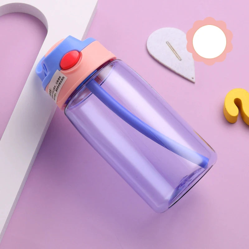 this is the purple kids water bottle with straw the lid has a peach coloured band at the bottom, the handle is purple matching the cup. the straw enclosure is also peach and the flip button is orange