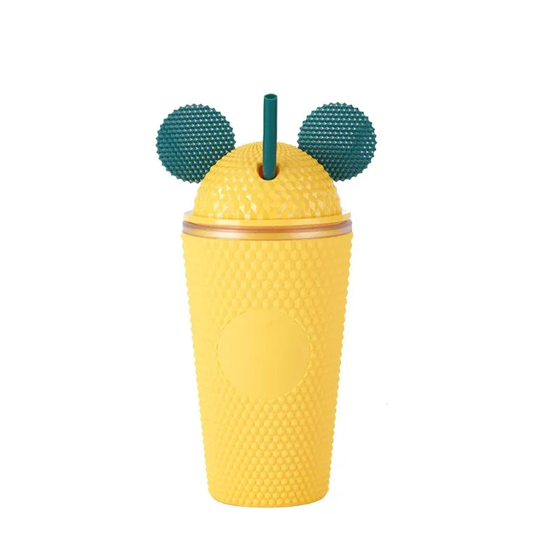 this shows the mouse ears tumbler cup in the colour yellow with green mouse ears and green straw