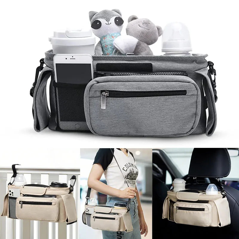 the grey bag stuffed full of phones, cuddly toys, bottles, dads coffee and shoulder strap, can also be clipped to back of car seat or hooked on stroller