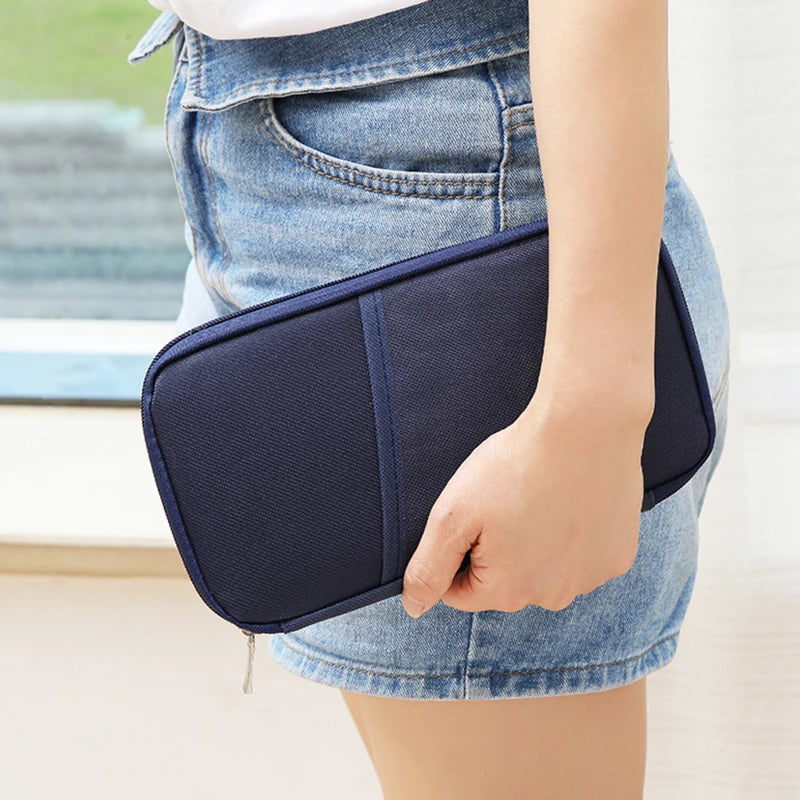 lady with denim shorts on holding a nay travel wallet