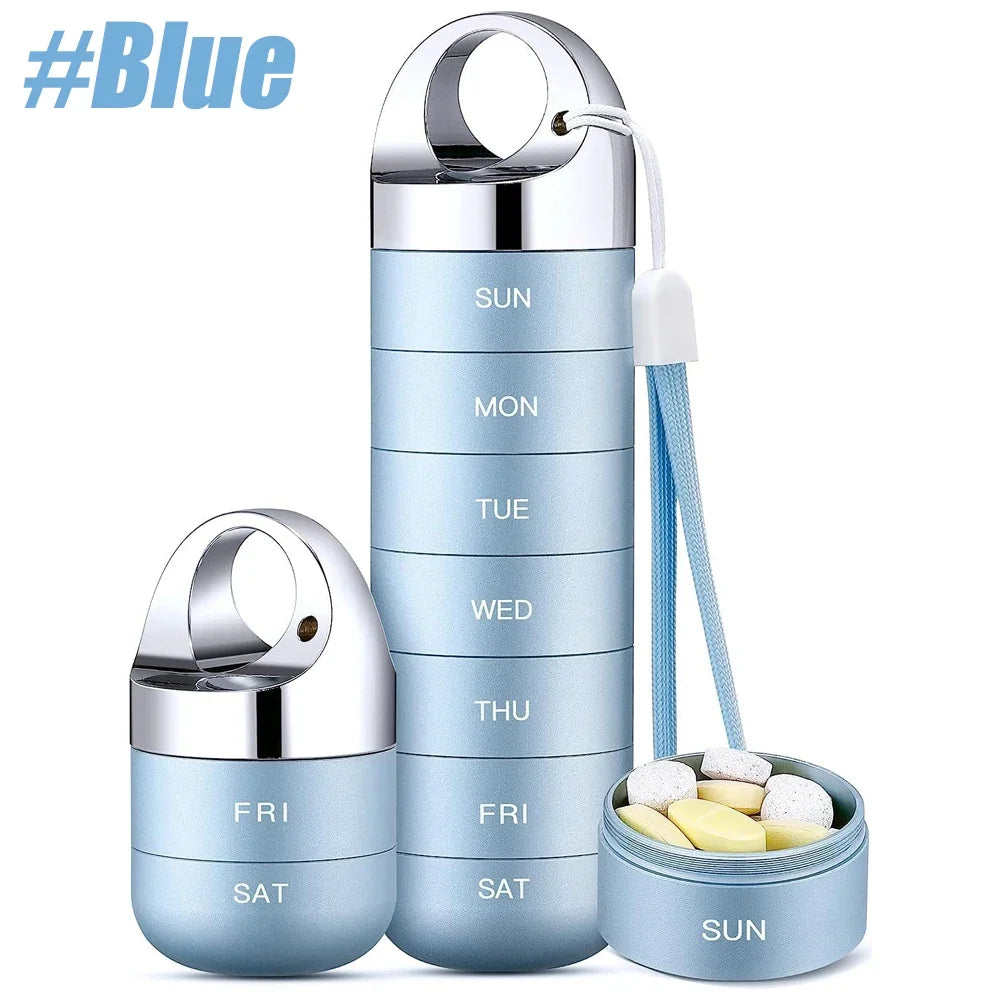 light Blue pill organizer with compartments for weekdays and a small container of pills on a white background.
