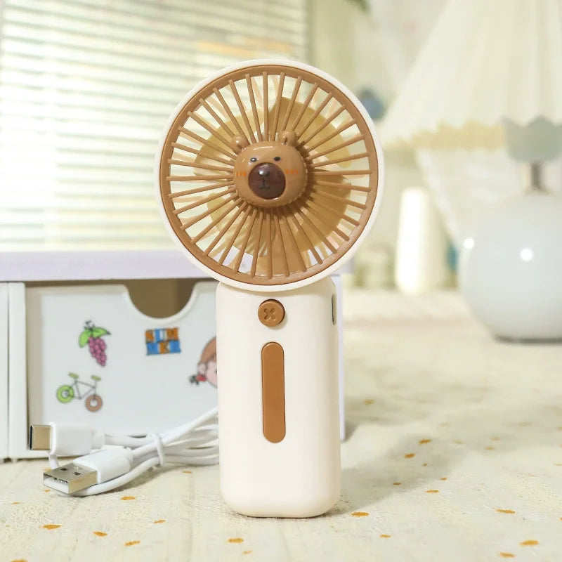 white capybara acute face handheld fan