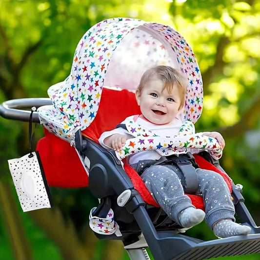 shows the stylish tissue holder dangling from a stoller