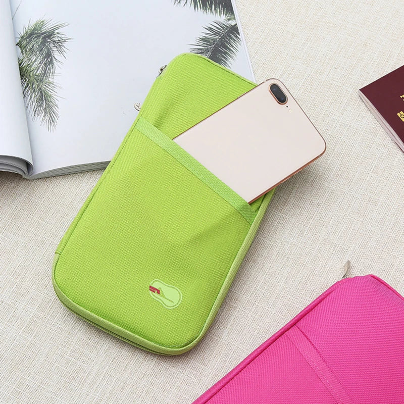 green travel wallet with phone sticking out of the back pocket