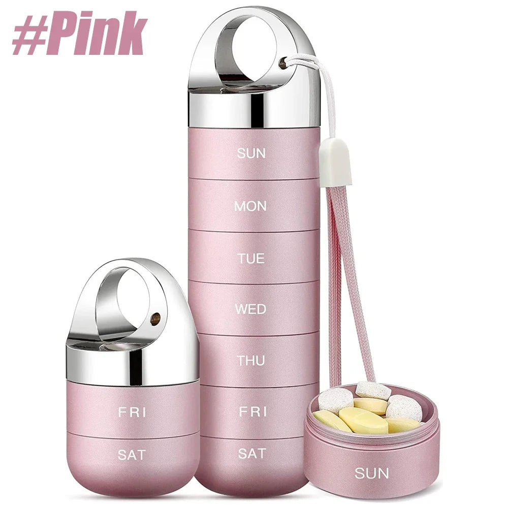 Pink pill organizer with silver lids on a white background