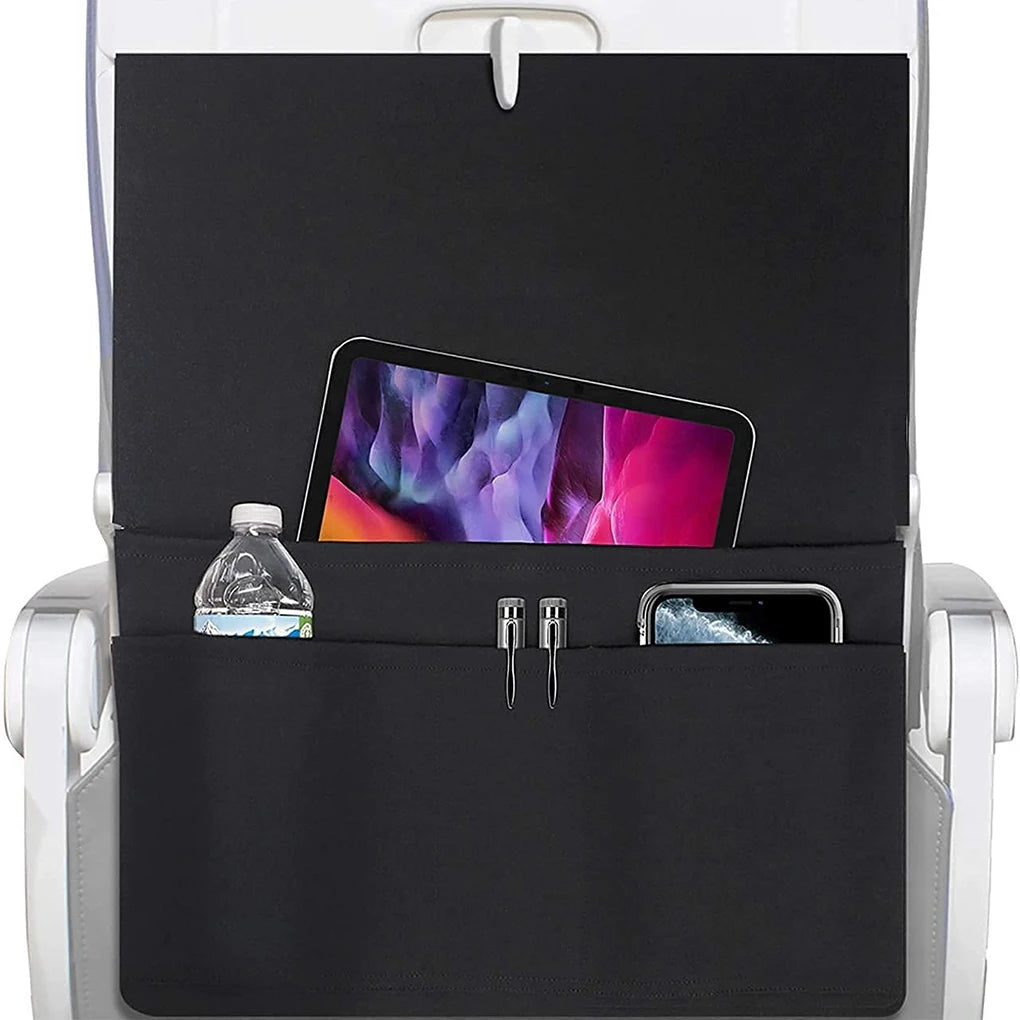 Black seatback organizer with tablet, water bottle, and phone on an airplane seat