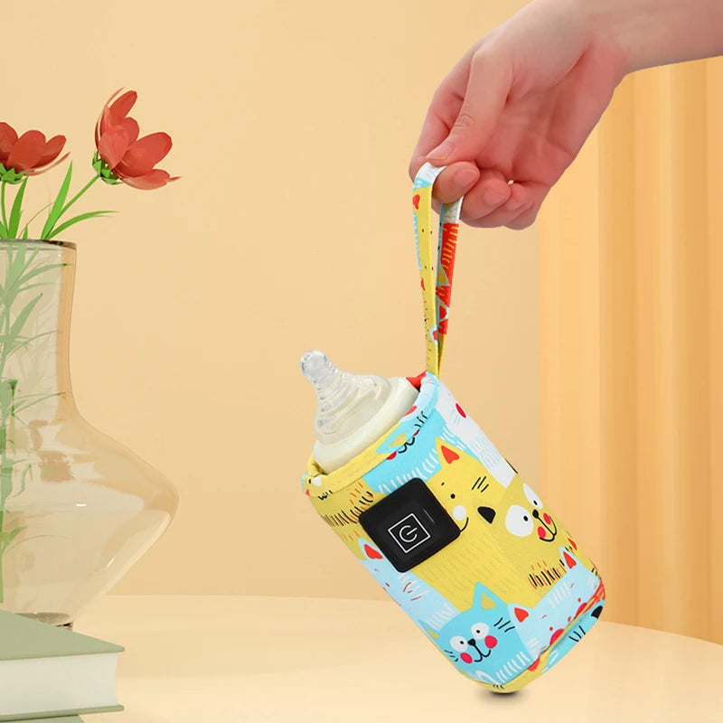 Colorful baby bottle warmer with cartoon design held by strap on a light yellow background