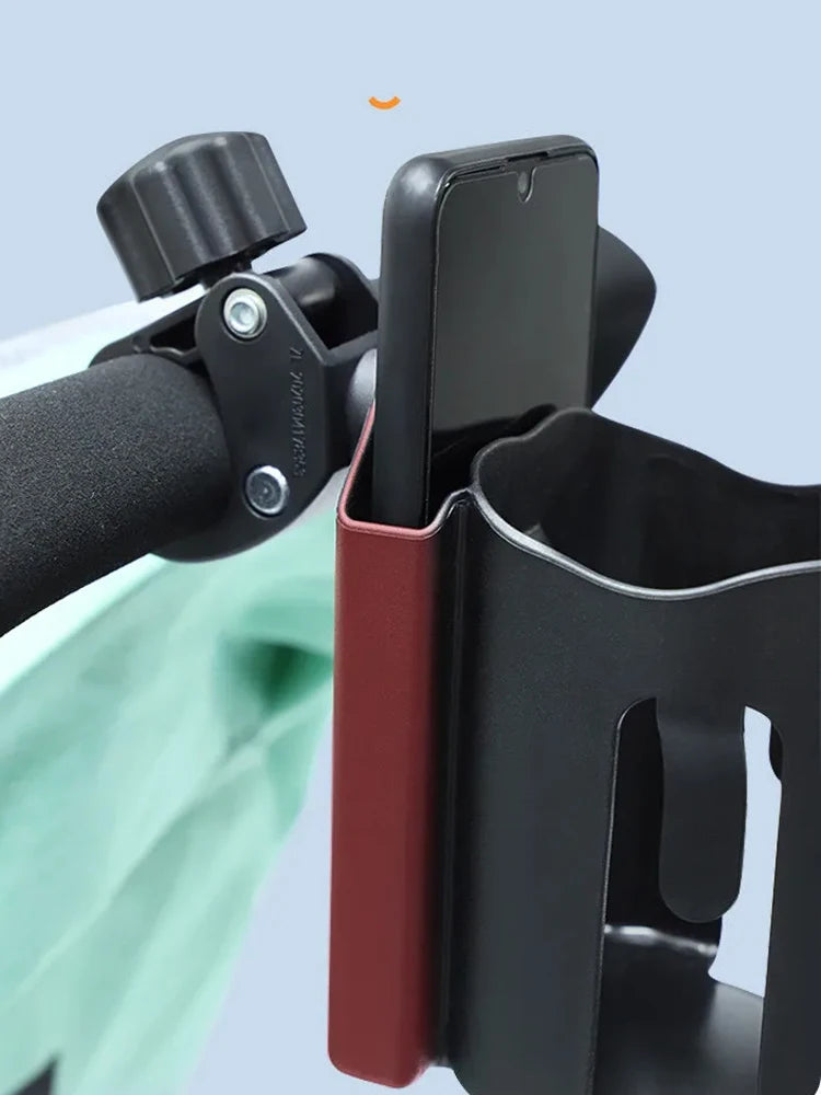 Phone holder attached to a stroller handlebar with a phone inside on a light blue background