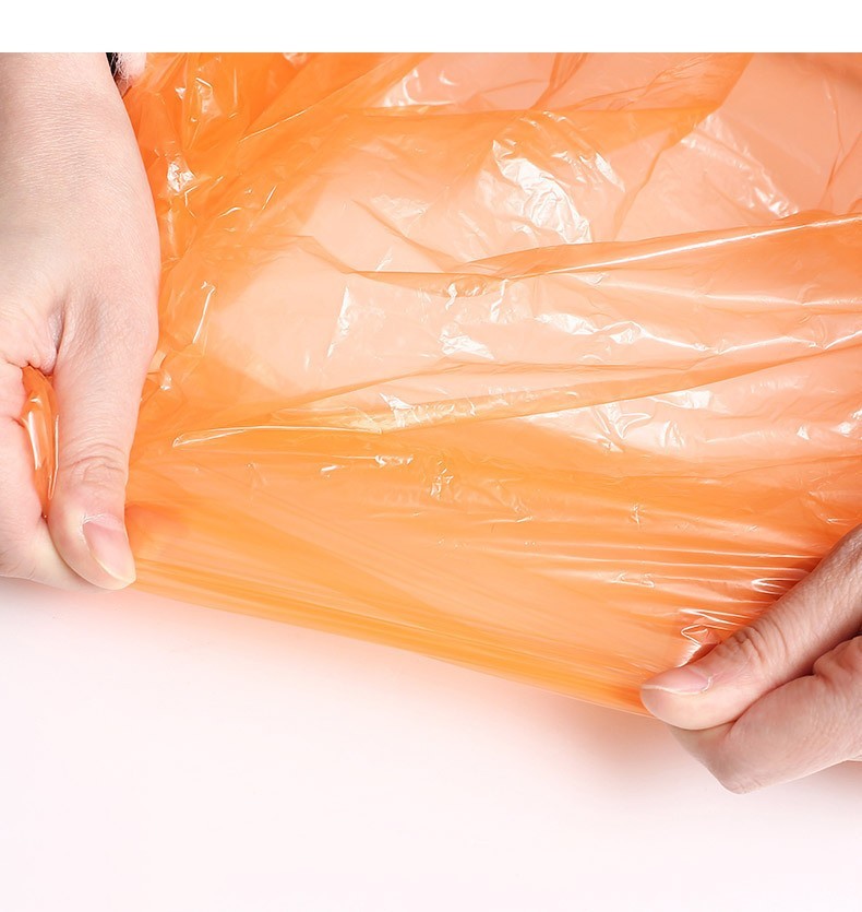 the image is of a person holding the disposable poncho to show the quality of the materials, it looks like plastic shopping bag material.