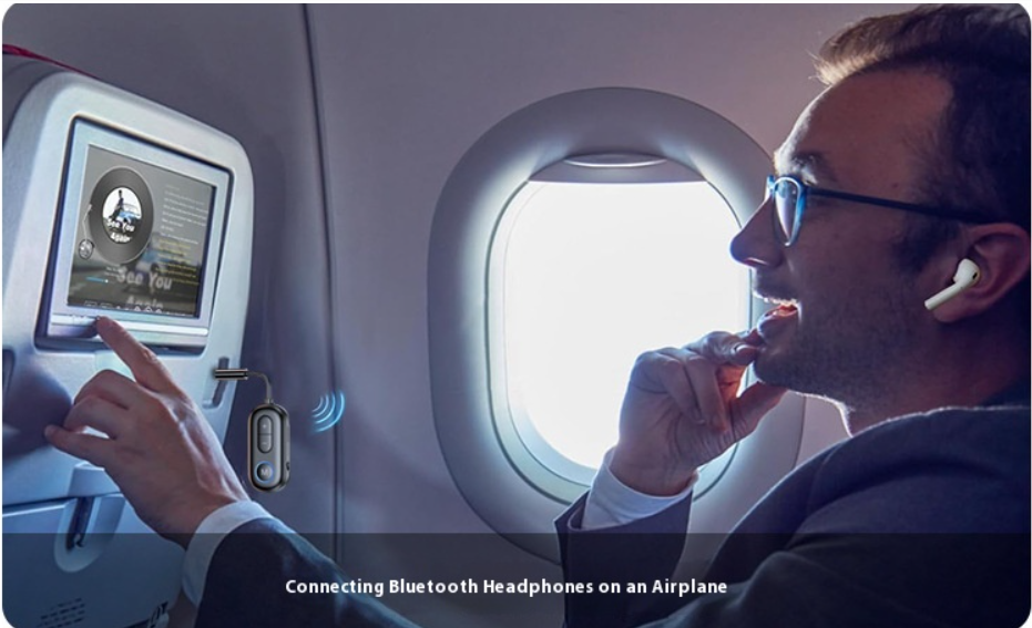 Person on a flight with adapter plugged in to the in flight entertainment system and they are sitting back in the seat with the airpods in their ears.