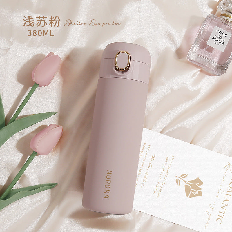 This is the light su Pink (powder pink) Aurora Bottle with gold edged flip button and gold Aurora Lettering