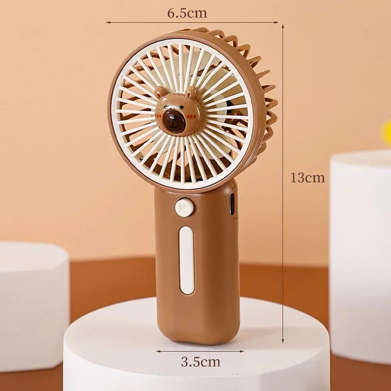 the brown fan is stood on a white box with measurements on top of the image. the fan is 13cm high, the width of the fan top is 6.5cm and the handle is a width of 3.5cm