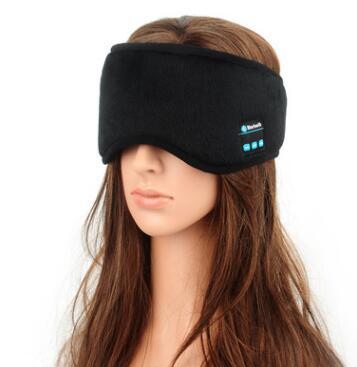 Black sleep mask with Bluetooth indicator on a mannequin head against a white background