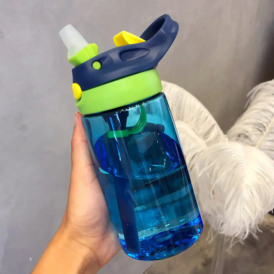 This image shows the side of the water bottle and built in straw and handle.