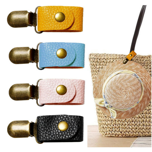 the photo has four hat clip colours showing yellow, light blue, pink and black. there is also a straw bag with the yellow strap clipped around the handle an a cute straw hat is clipped in the hat clip.