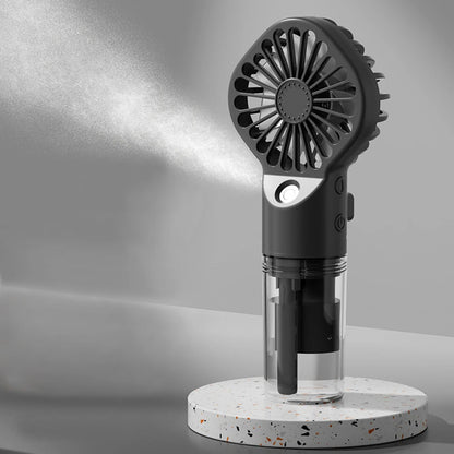 Handheld black fan  on a gray background