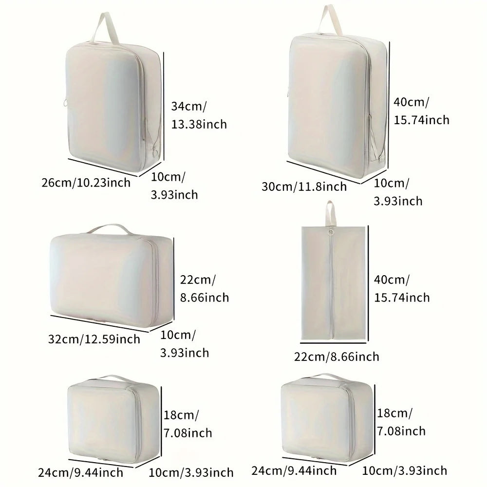 Set of white packing cubes with dimensions labeled on a white background