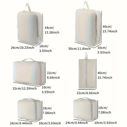 Set of white packing cubes with dimensions labeled on a white background