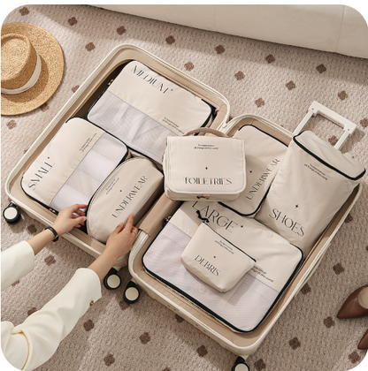 This shows and open suitcase with the 8 piece set of packing cubes. this beige/cream set with black writing on is an aesthetically pleasing set of packing cubes. This set includes clothing storage bag in small, medium and large, toiletries bag with hook, underwear bag, shoe bag and sundry bag which can be used for gadgets, cables or make up.